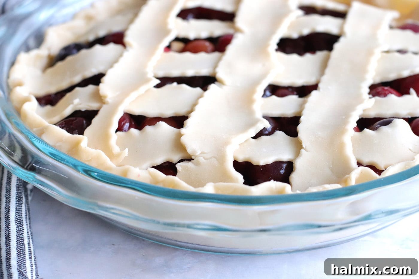 dough tucked into cherry pie