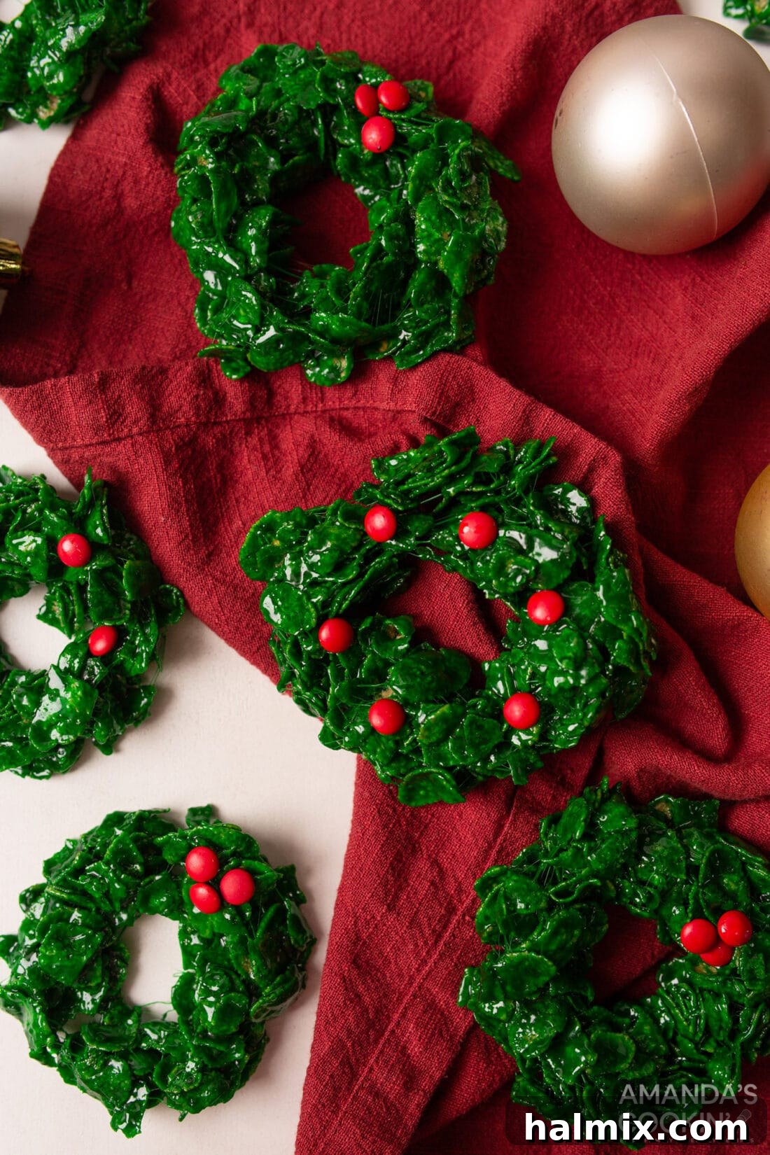 Easy Cornflake Holiday Wreaths 2 Cornflake Christmas Wreath Cookies with a red linen