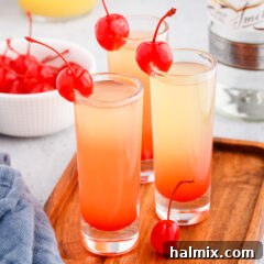Pineapple Upside Down Cake Shot with a cherry garnish
