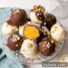 A close-up of a beautifully decorated cake ball, showcasing the smooth coating and sprinkles.