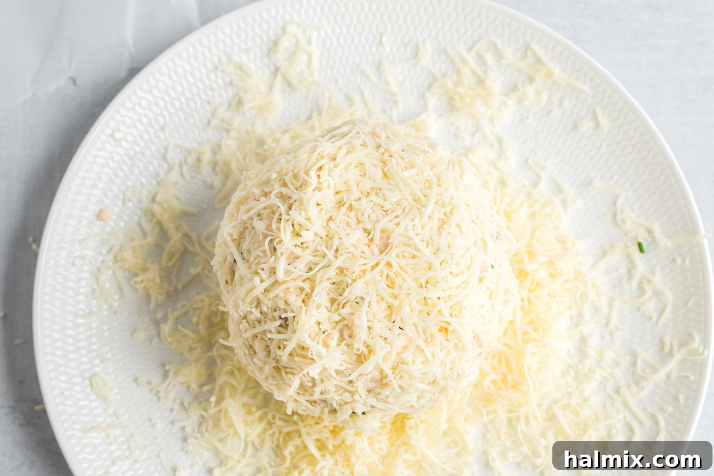 Festive Snowman Cheeseball 8 mozzarella cheese on gouda cheeseball