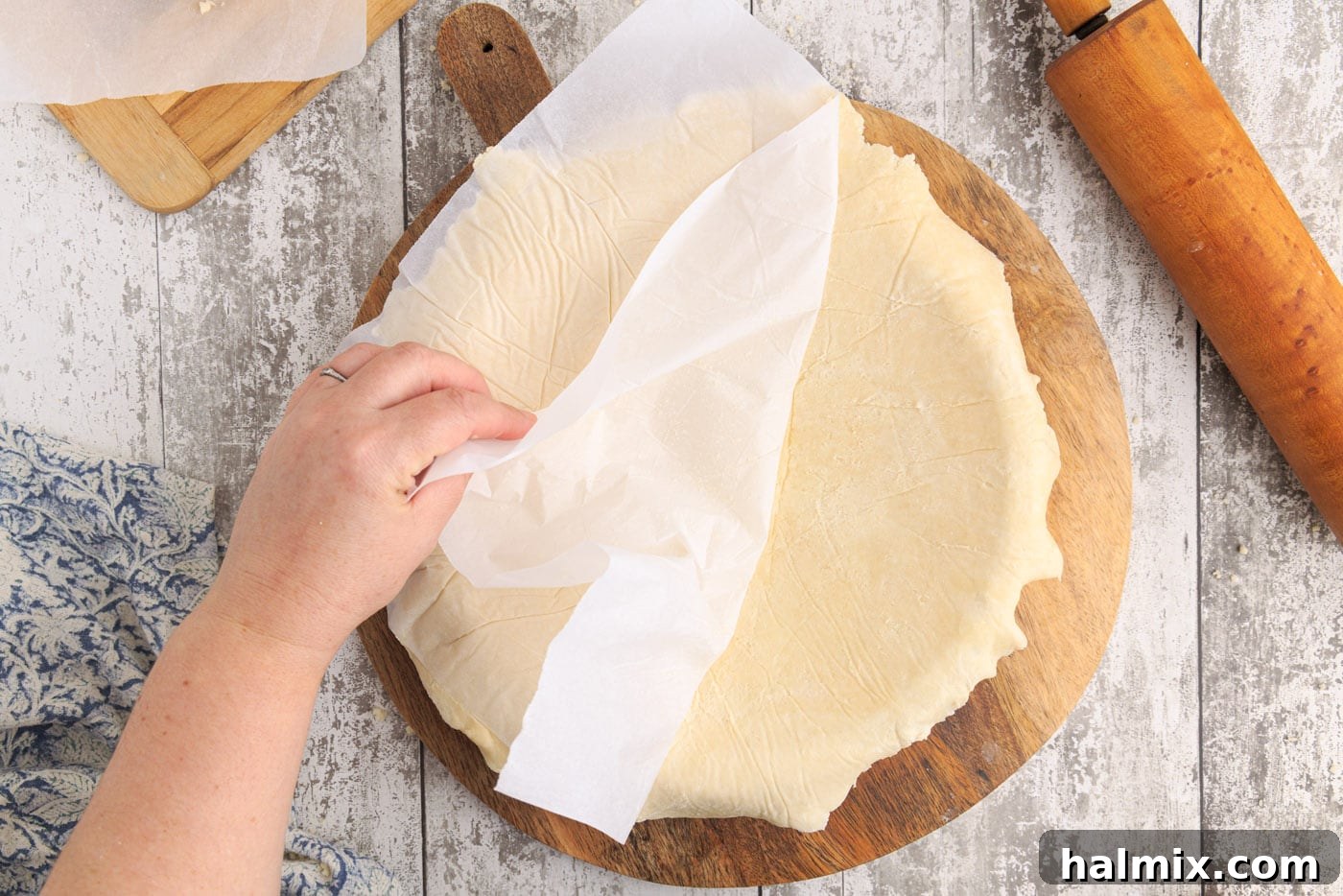 Unbaked pie dough neatly settled into a ceramic pie plate