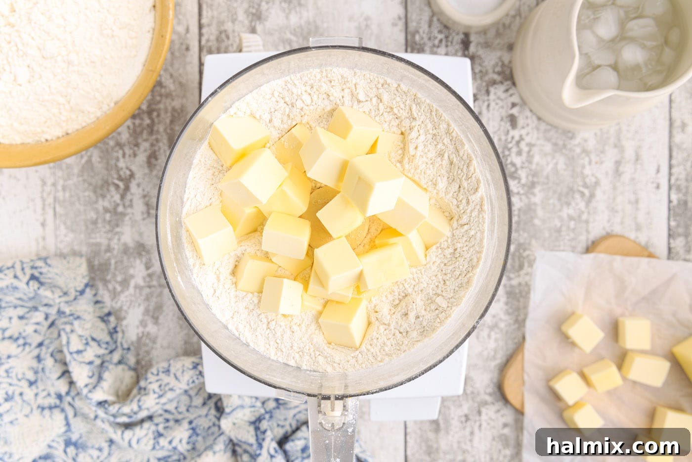 Butter and flour mixture resembling coarse crumbs in a food processor