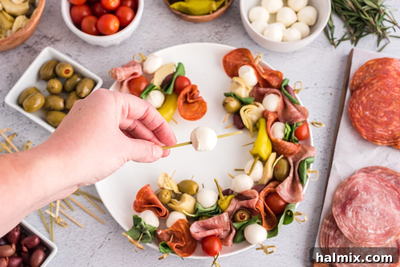 Mozzarella pearl threaded onto a skewer