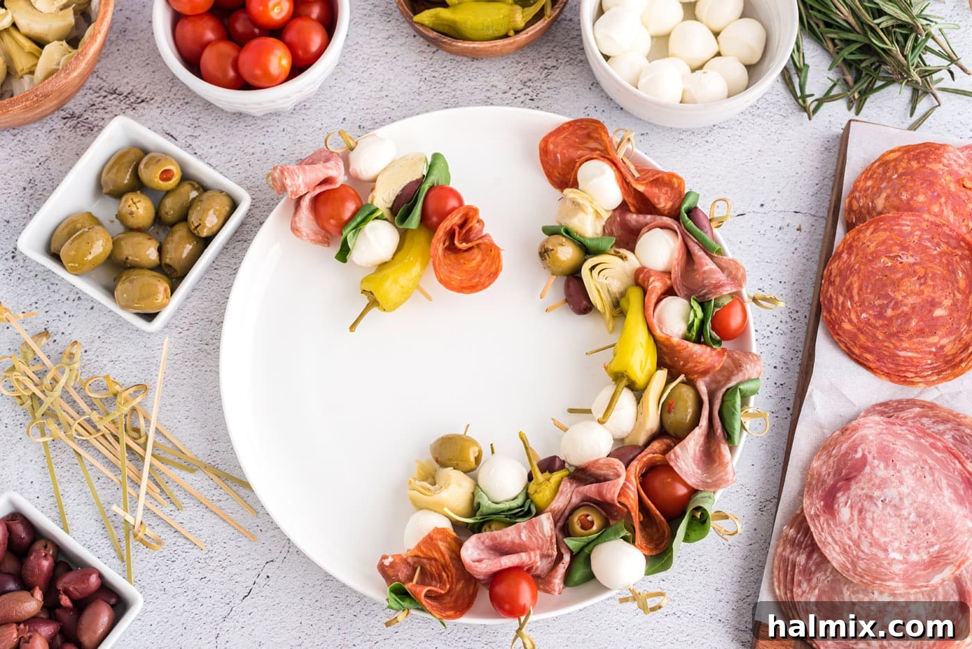 Antipasto skewers arranged in a wreath shape on a platter