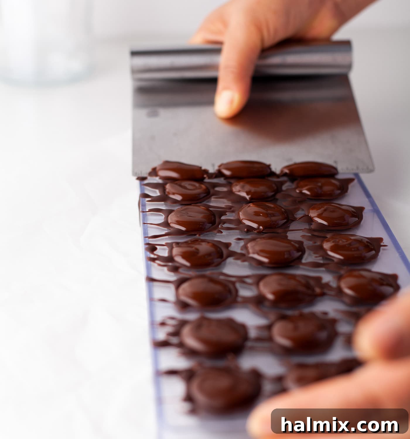 Decadent Dream Truffles 13 scraping chocolate off of candy mold