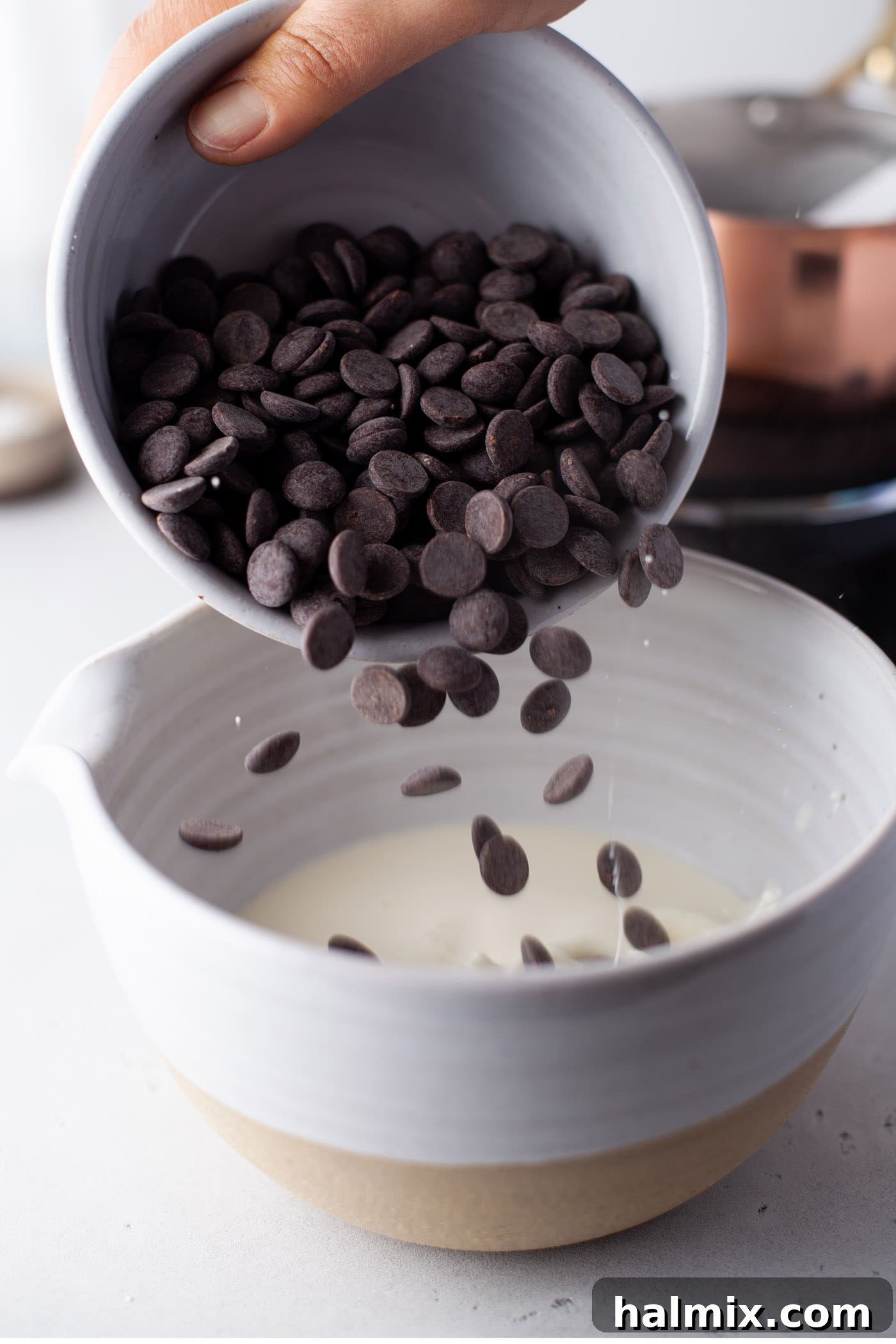 Decadent Dream Truffles 6 pouring chocolate chips into whipping cream