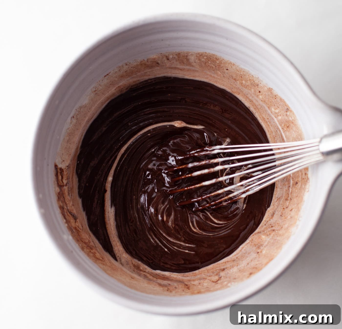 Decadent Dream Truffles 7 whisking together whipping cream and melted chocolate