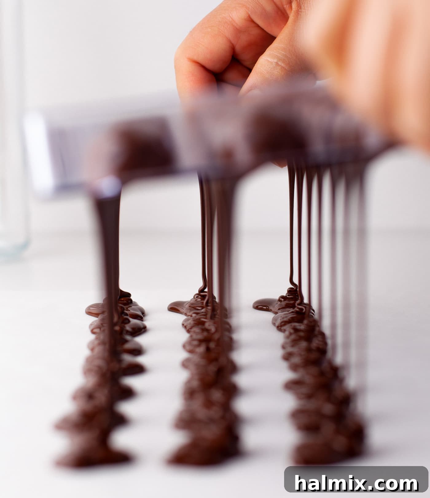 Decadent Dream Truffles 10 chocolate dripping out of candy mold