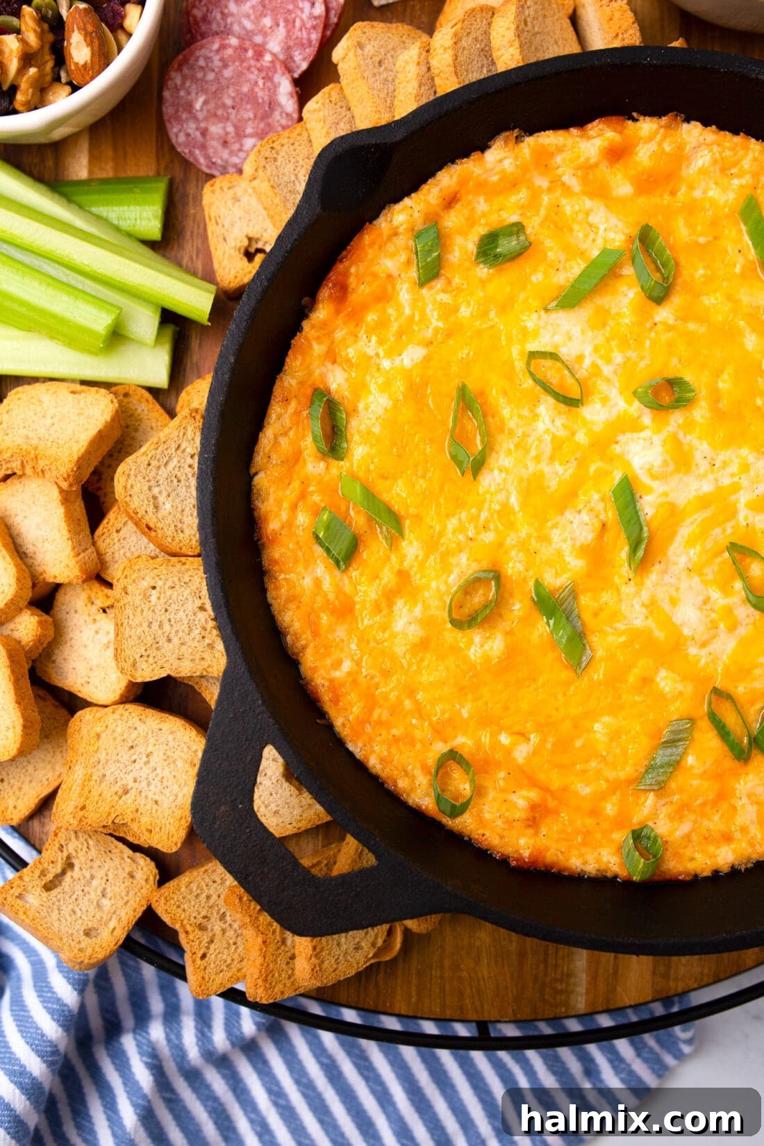 Crab Dip in a skillet, baked to golden perfection, ready to serve.