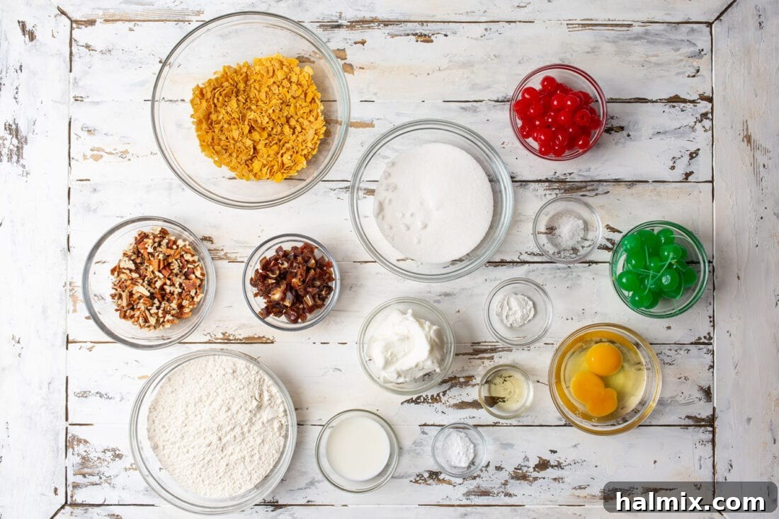 A display of fresh ingredients for Cherry Wink Cookies, including flour, sugar, eggs, maraschino cherries, pecans, dates, and cornflakes, neatly arranged for baking.
