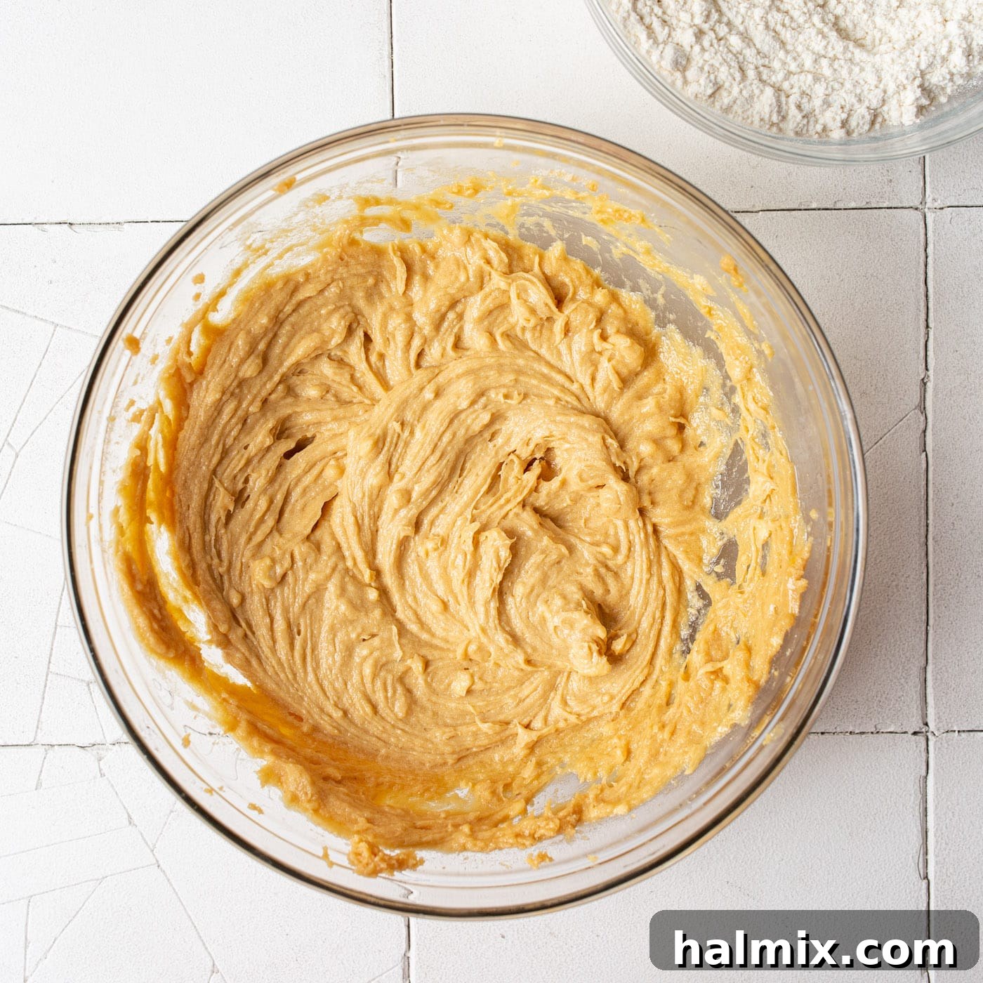 A bowl of peanut butter cookie dough chilling in the refrigerator
