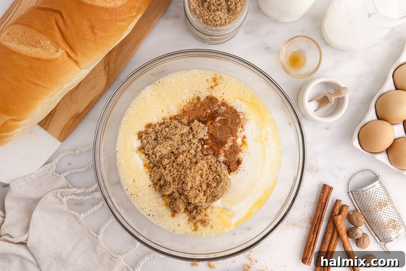 Decadent Bread Pudding Delight 5 eggs, brown sugar, spices, and buttermilk in a mixing bowl