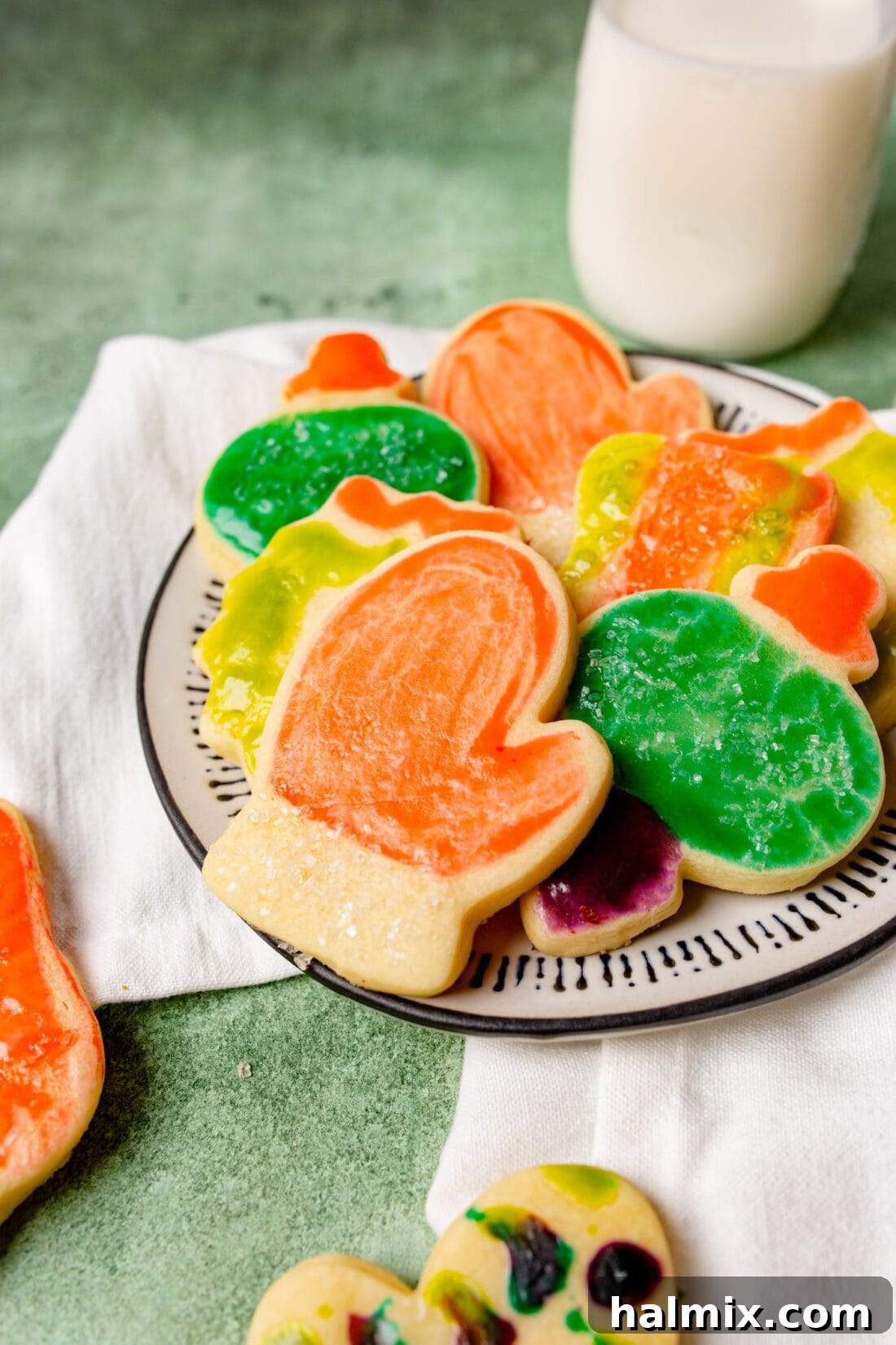 Brushstroke Delights 2 A plate full of beautifully decorated paintbrush cookies, ready to be enjoyed.
