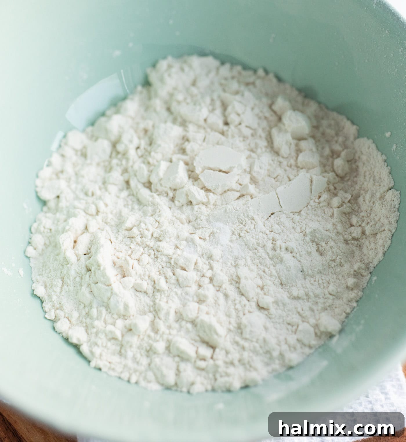 Flour, baking soda, and salt mixed in a bowl