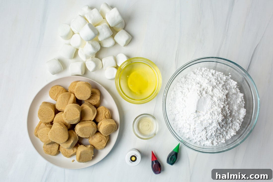 Assorted ingredients including egg whites, vanilla, powdered sugar, marshmallows, and food coloring for melted snowman cookies.