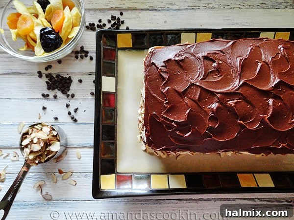 An overhead photo highlighting the beautiful presentation of a whole Cassata Cake on a serving plate.