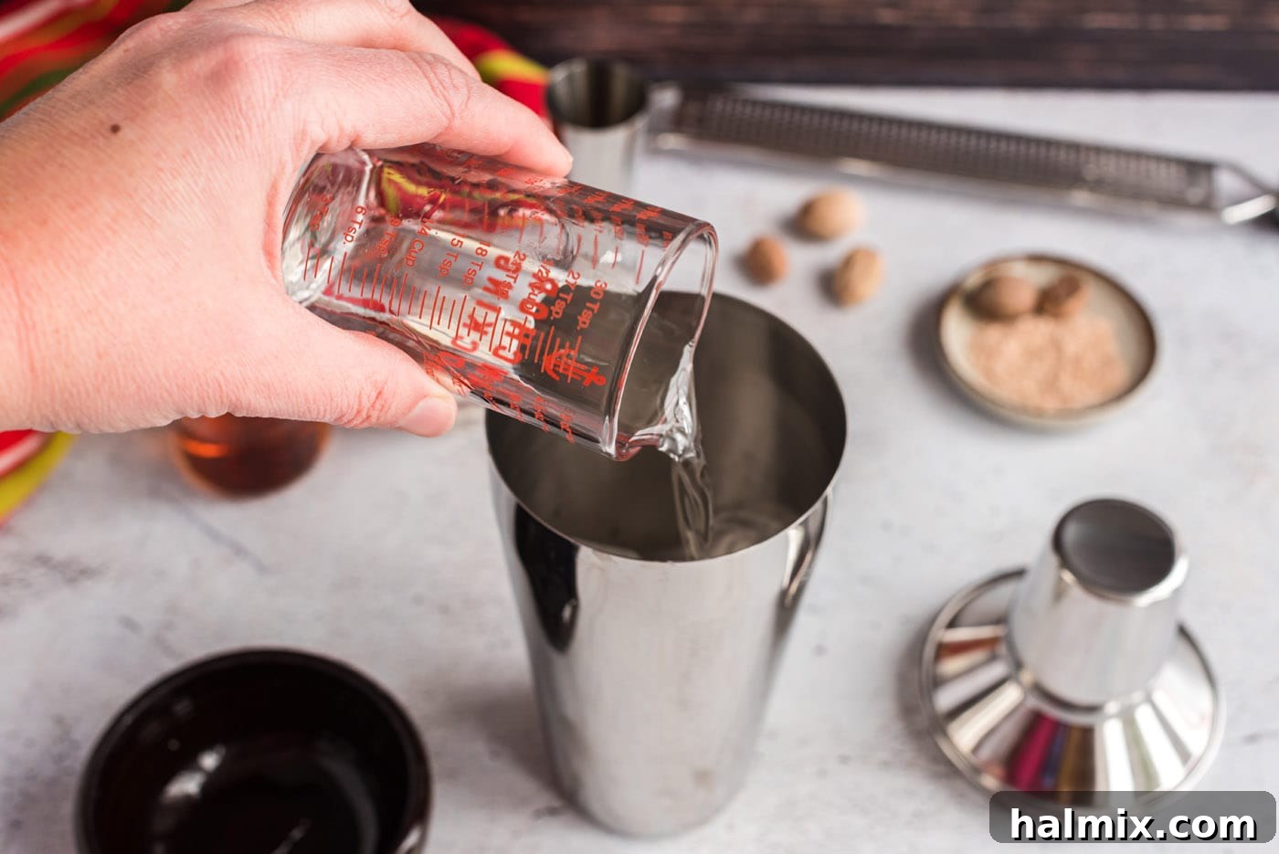 Velvet Brandy Dream 5 pouring creme de cacao into cocktail shaker