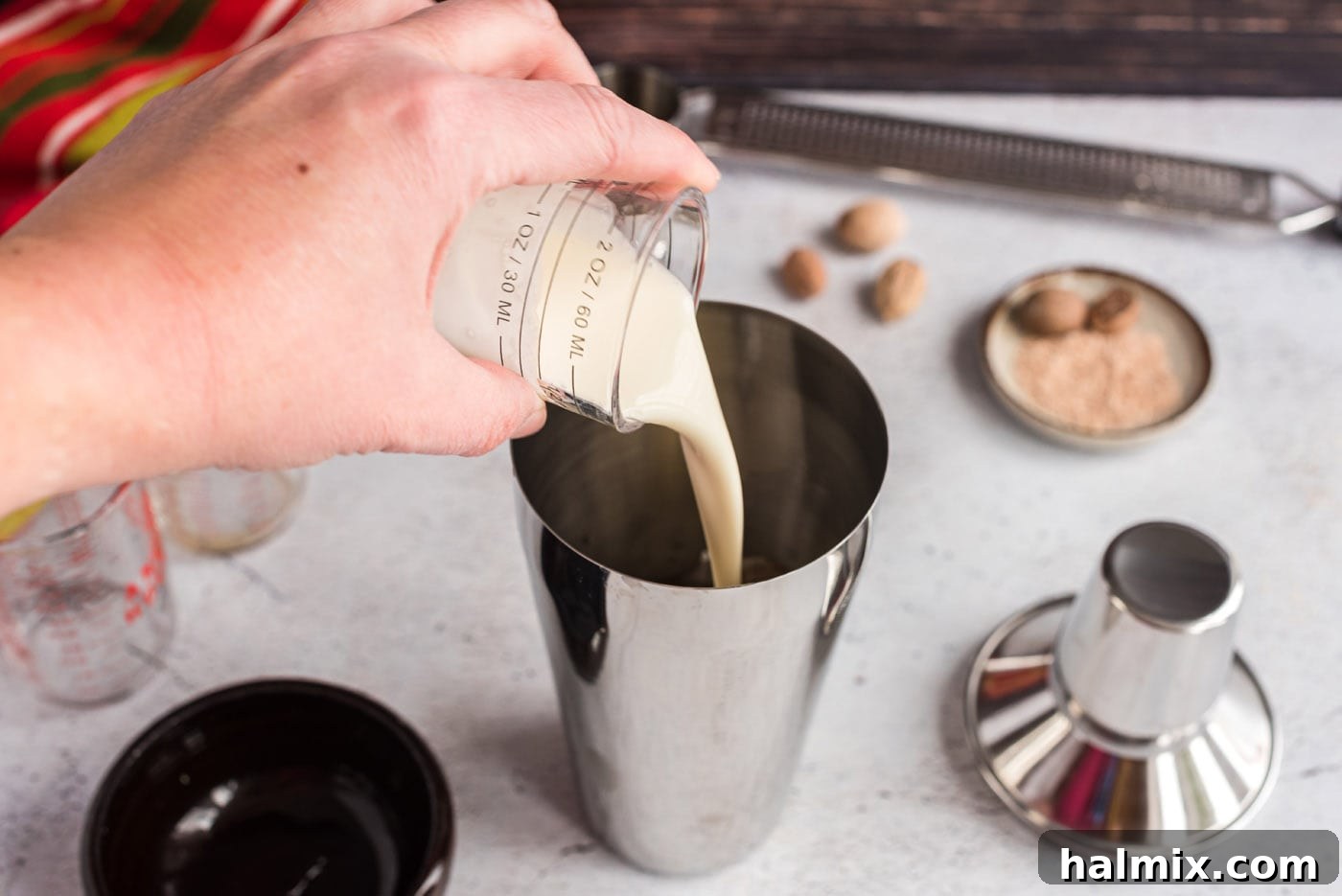 Velvet Brandy Dream 7 pouring cream into cocktail shaker