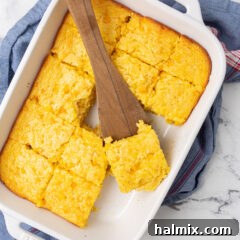 A small round dish of corn casserole, ready to be served.