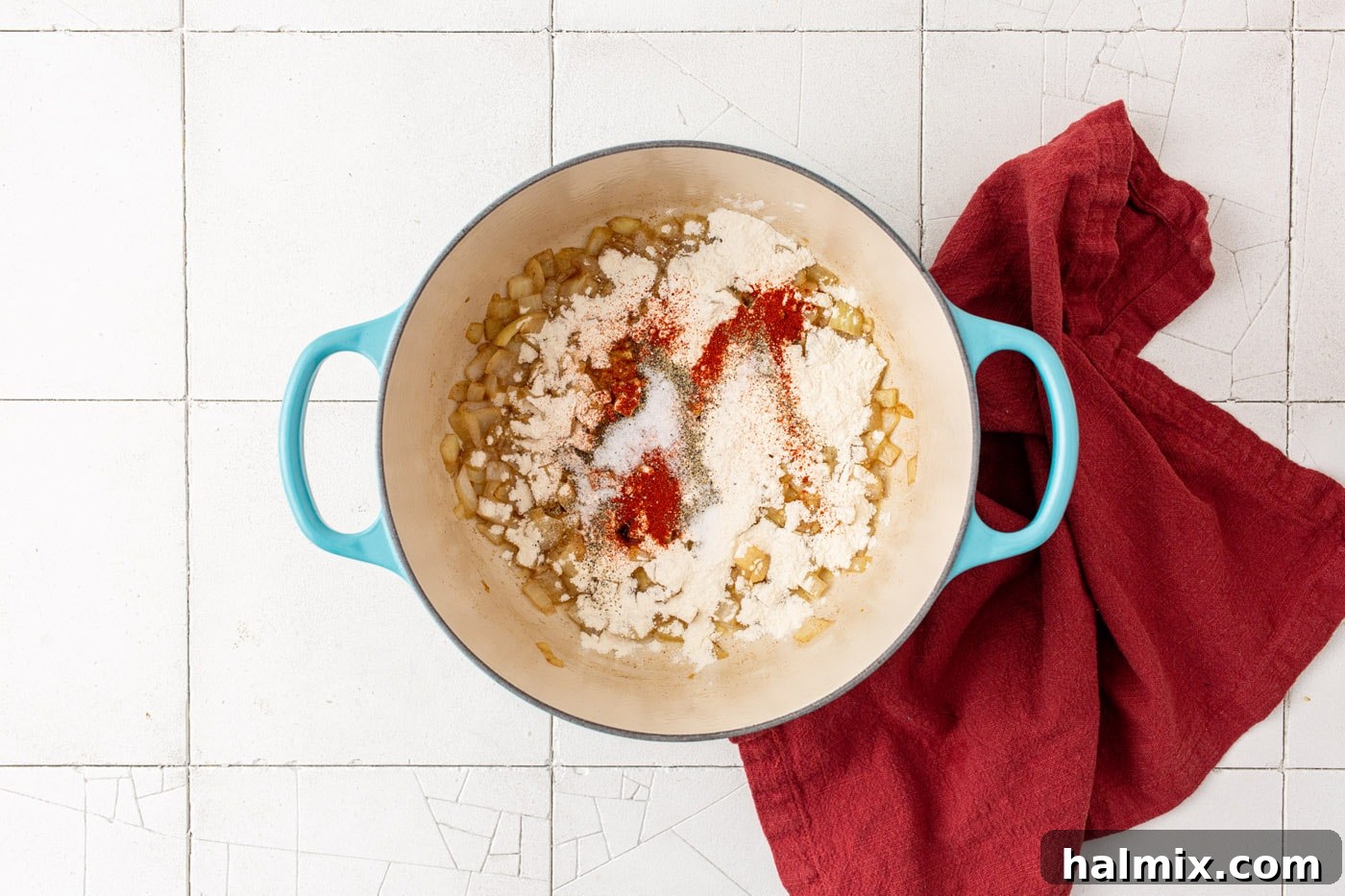 seasonings, flour, onion, and garlic in a dutch oven