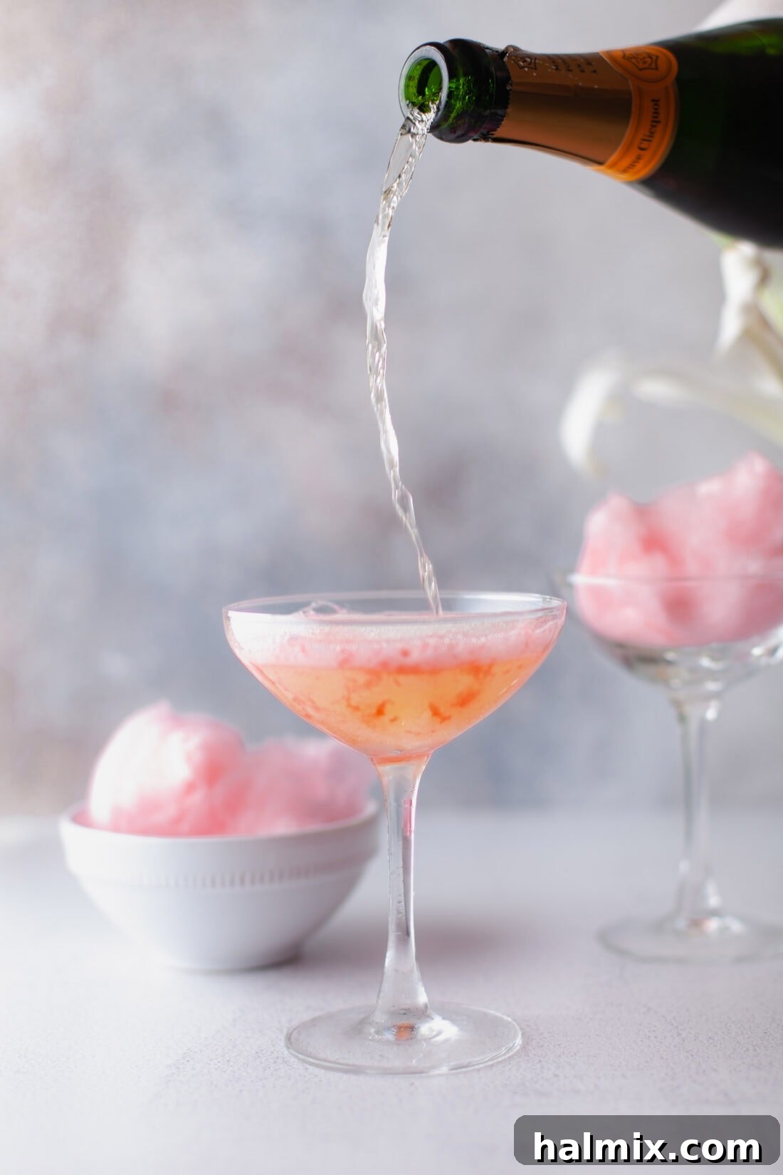 Sweet Cloud Sparkle 7 pouring champagne into cotton candy champagne