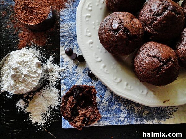 Starbucks Hot Cocoa Chocolate Chip Muffins Freshly baked Starbucks Hot Cocoa Chocolate Chip Muffins on a cooling rack.