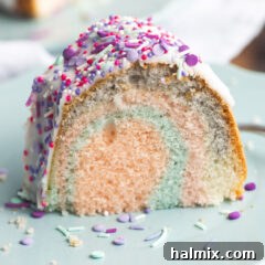 Unicorn Bundt Cake, featuring colorful swirls and a vanilla glaze with sprinkles.