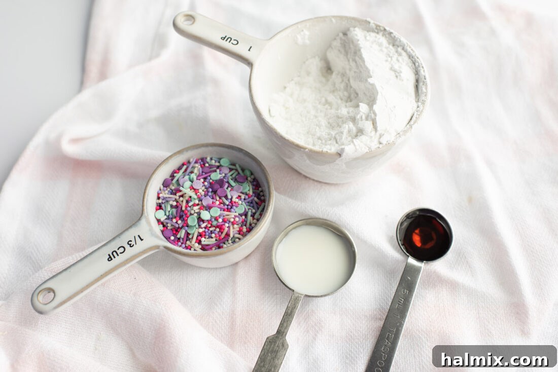 Ingredients for the vanilla glaze including powdered sugar, milk, vanilla extract, and a selection of colorful sprinkles.