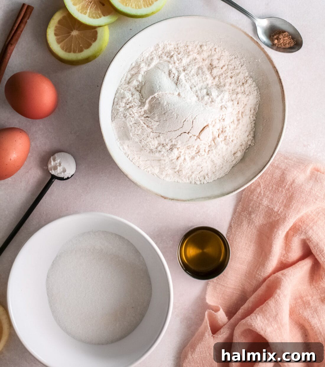 Zesty Baked Lemon Donuts 4 A collection of ingredients laid out for making Lemon Baked Donuts