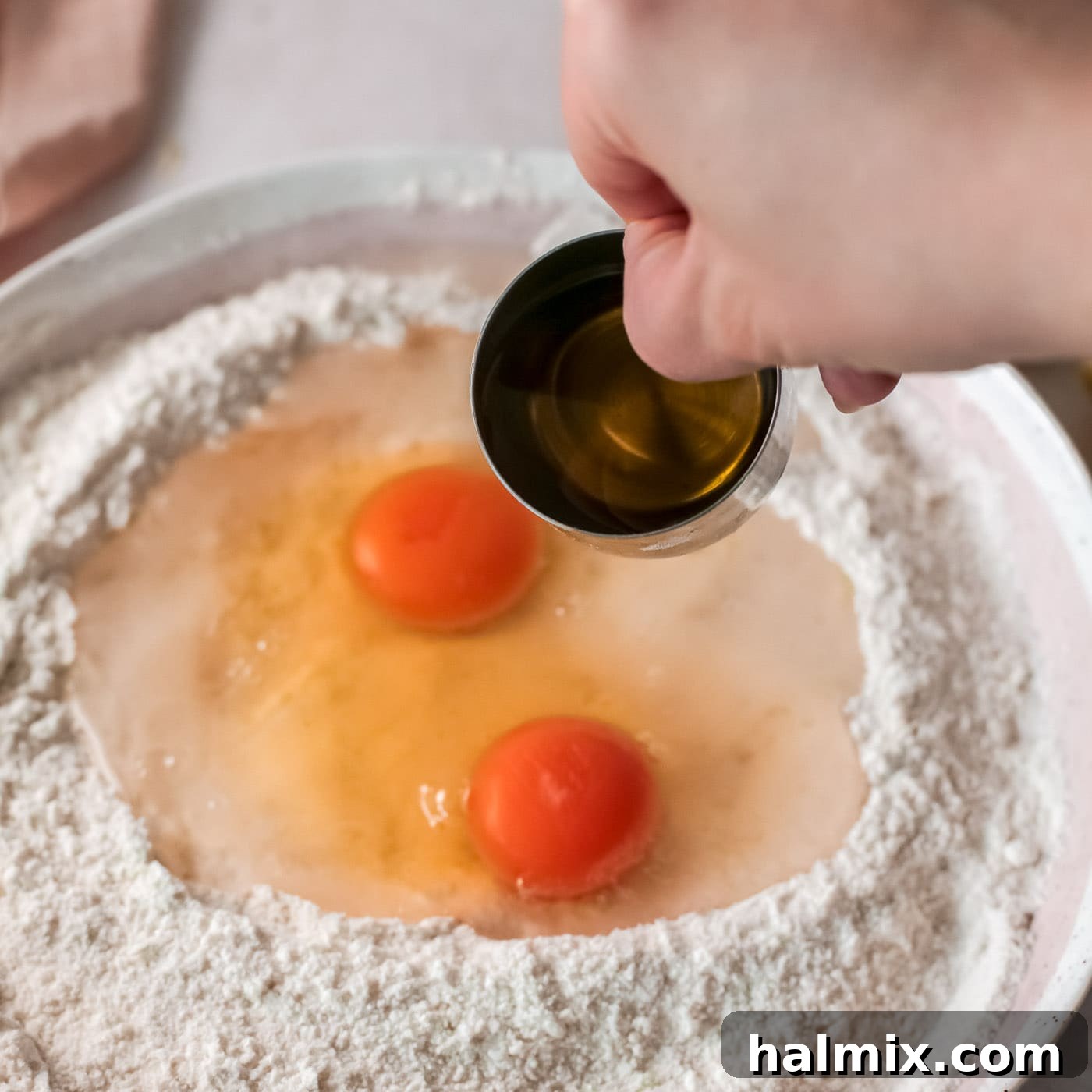 Zesty Baked Lemon Donuts 6 wet ingredients poured into the well of dry flour mixture for donuts