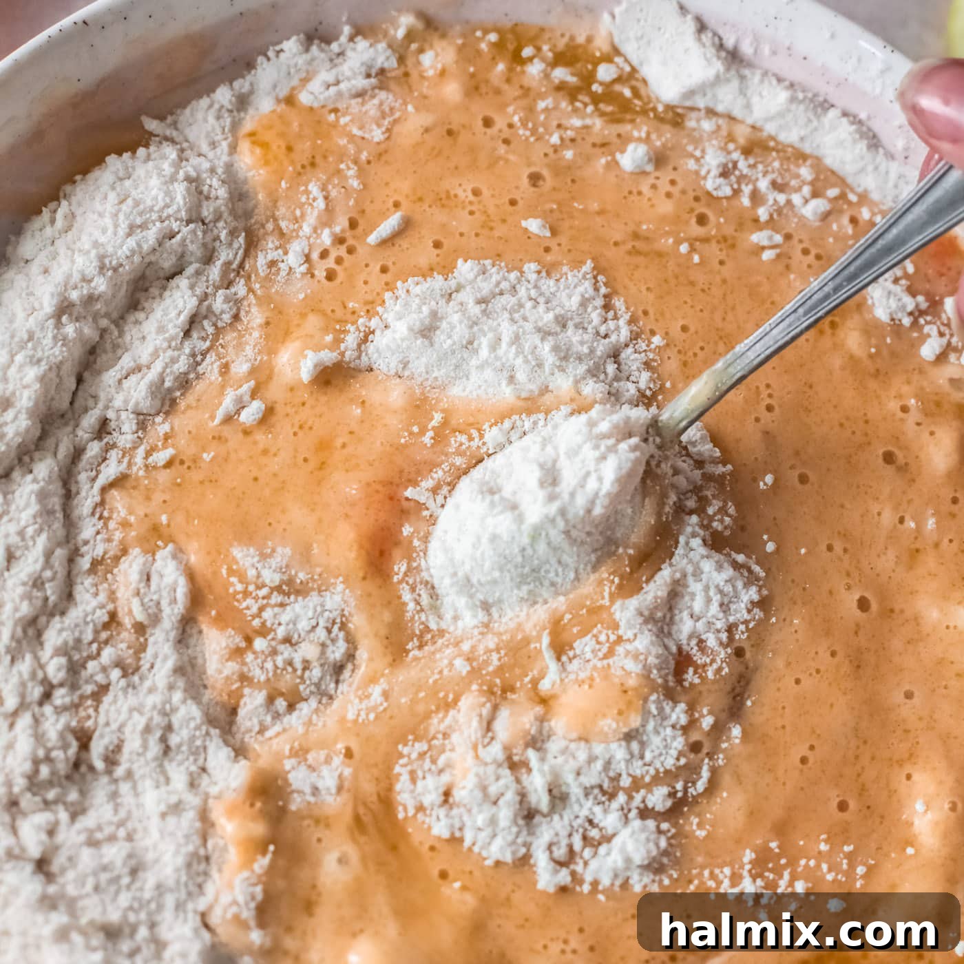 Zesty Baked Lemon Donuts 7 mixing wet ingredients into dry ingredients for lemon donuts