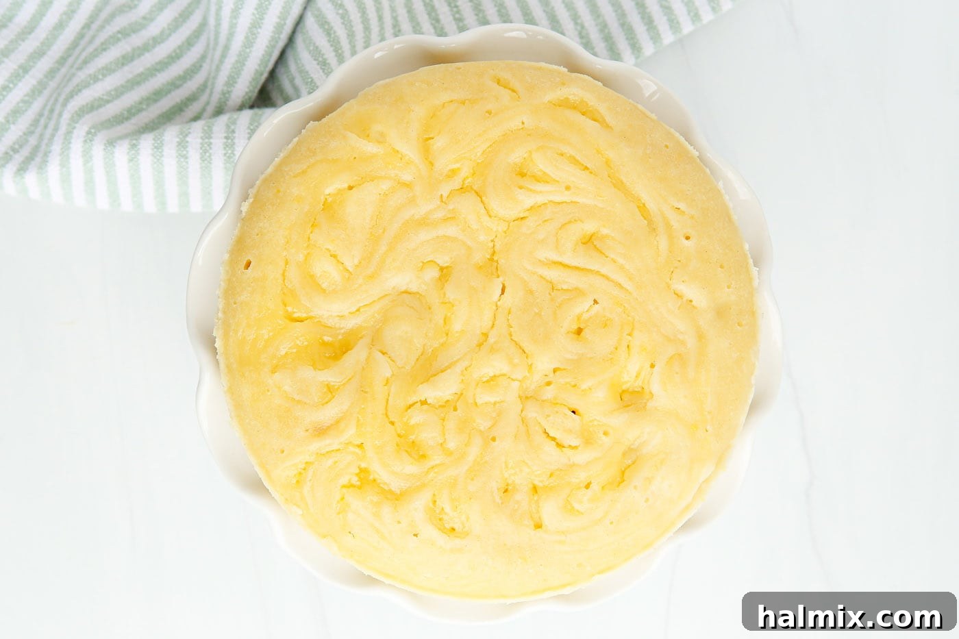 Zesty Instant Pot Lemon Cake 7 An overhead view of the perfectly golden Instant Pot Lemon Cake, fresh out of the pressure cooker and cooling.