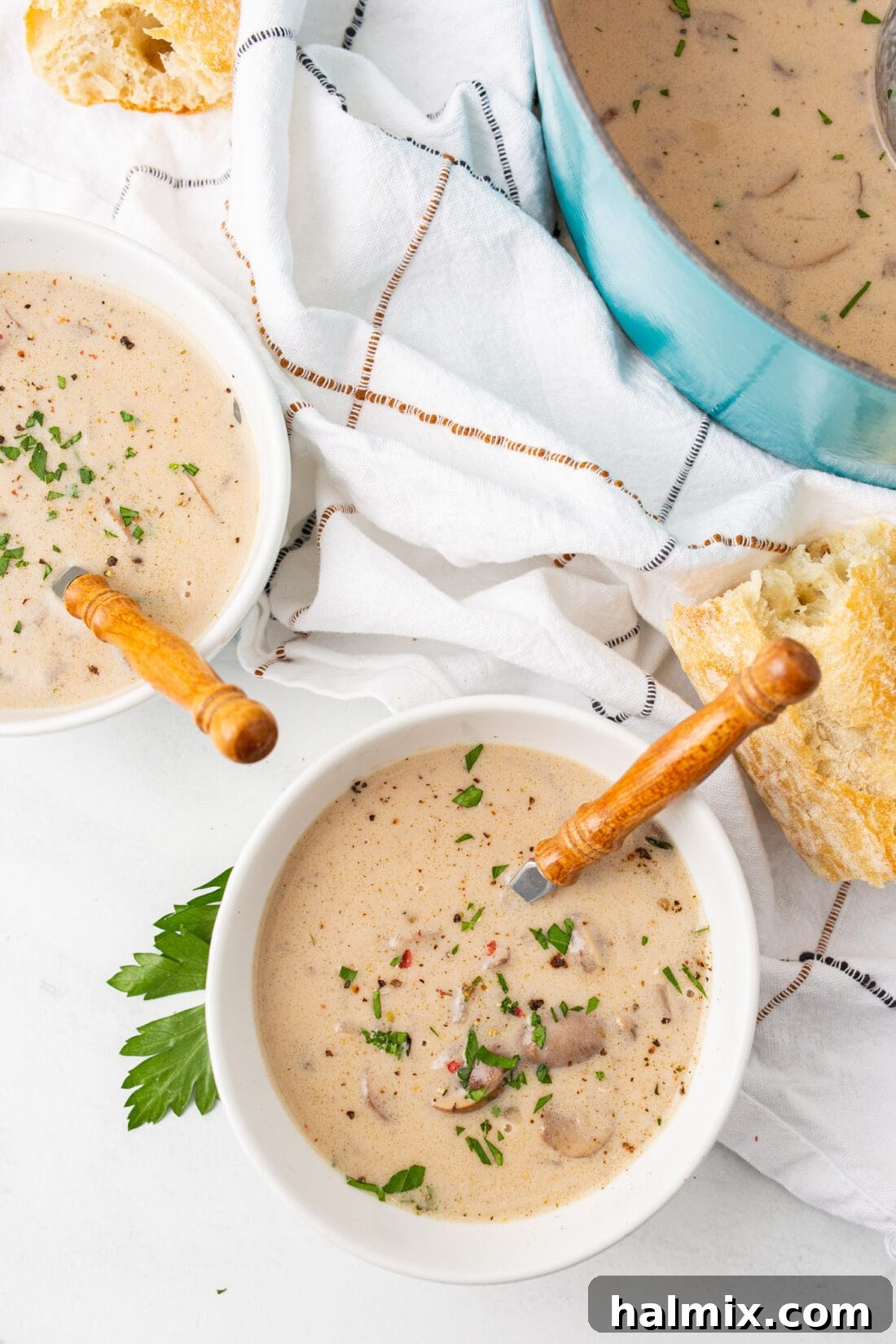 A cozy bowl of Cream of Mushroom Soup, garnished with fresh herbs, ready to be enjoyed.