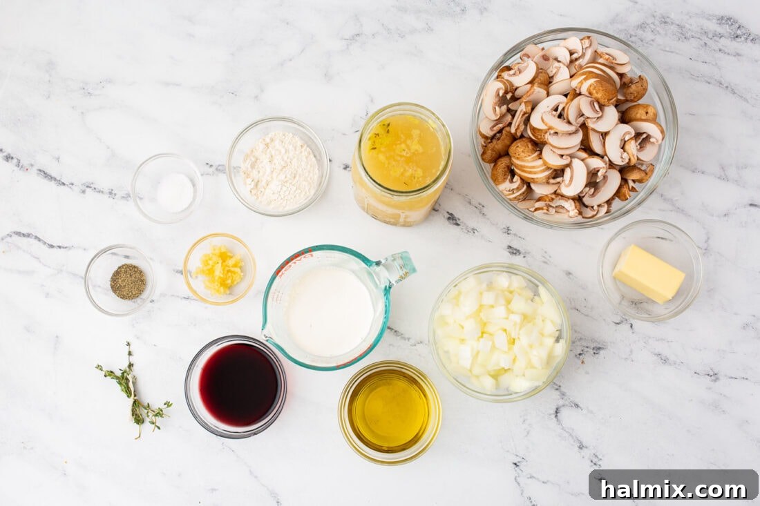 Various fresh ingredients for Cream of Mushroom Soup, including sliced mushrooms, onions, garlic, and herbs, arranged on a countertop.