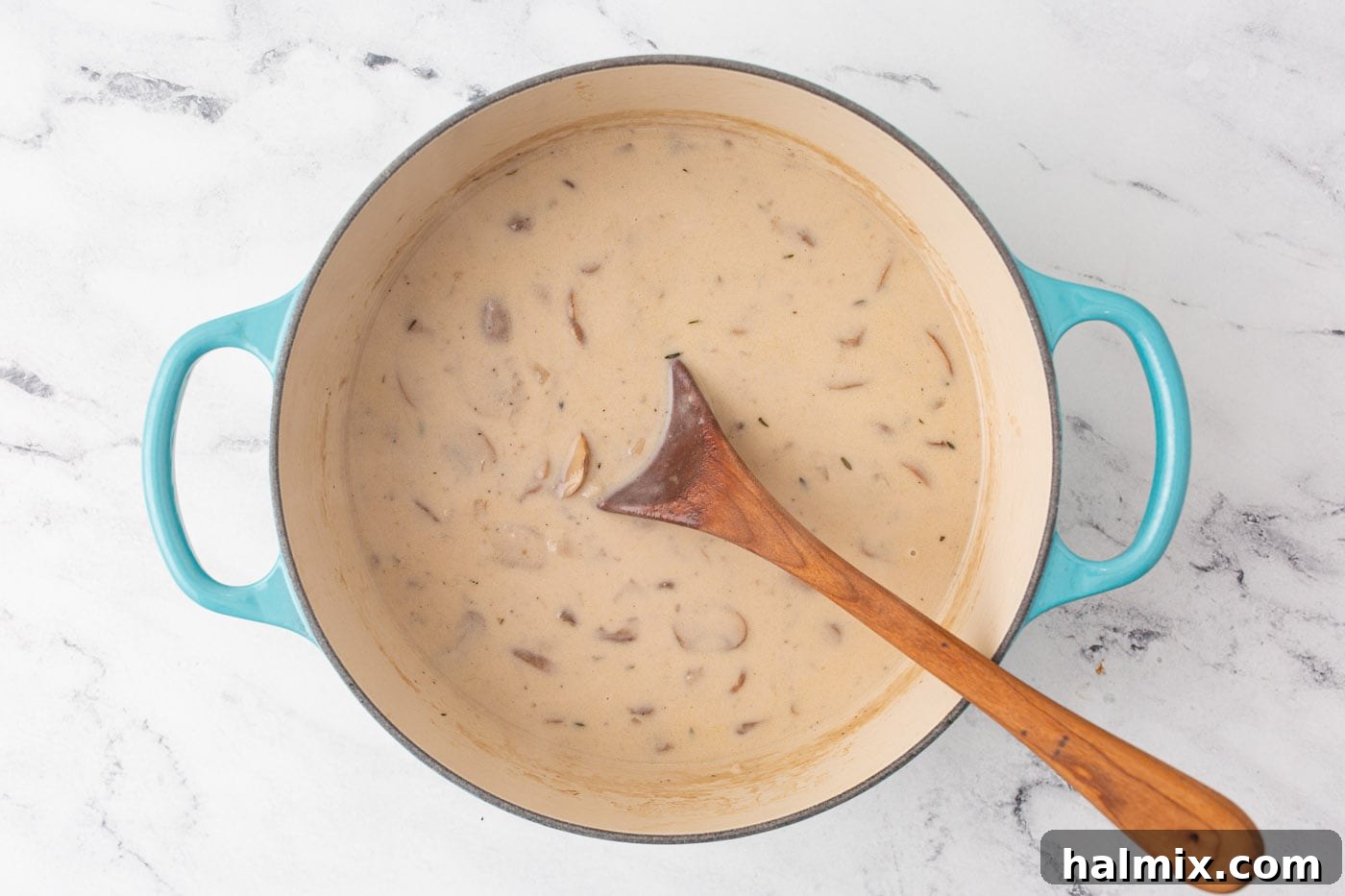 Finished Cream of Mushroom Soup in a Dutch oven, creamy and ready to serve.