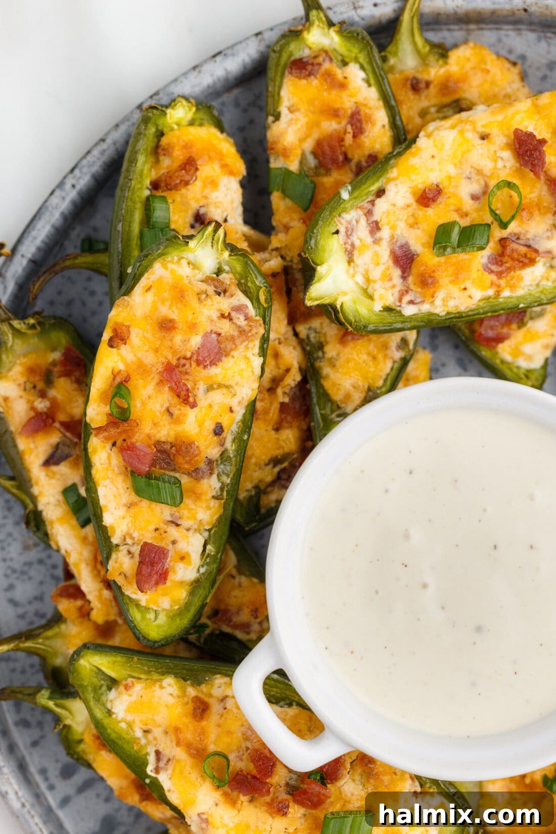 Crispy Firecrackers 2 Jalapeno Poppers with a bowl of dip