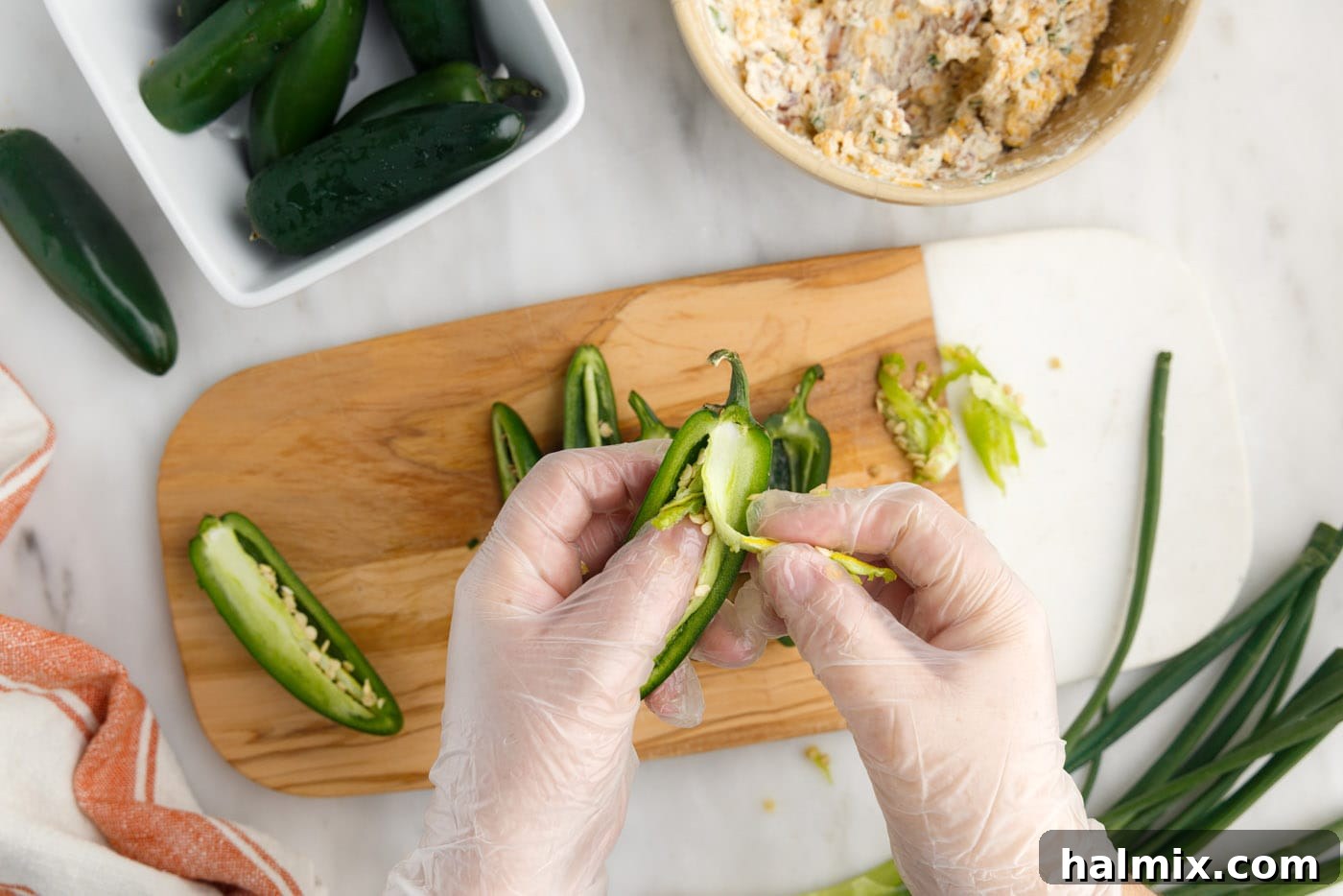 hands scooping jalapeno ribs