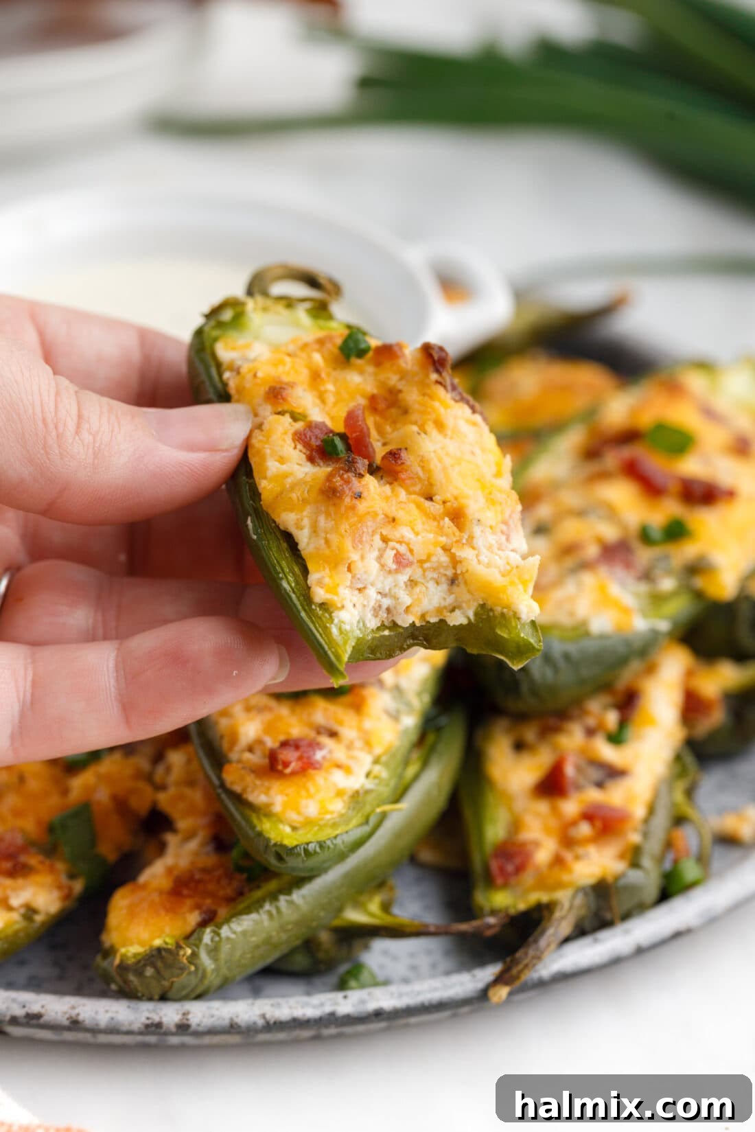 Crispy Firecrackers 8 Jalapeno Popper with a bite out of it