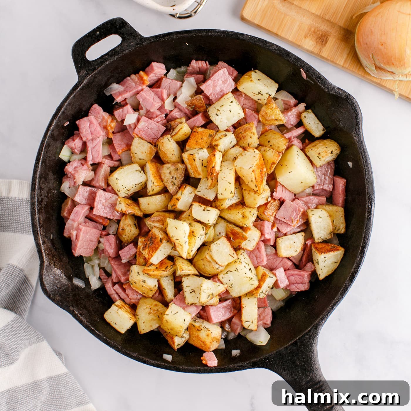 Sizzling Corned Beef and Potato Medley 9 Cubed potatoes, corned beef, and onions combined in a skillet