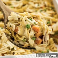 Creamy Tuna Bake 6 Close up photo of a spoonful of Tuna Casserole, showing creamy texture and crunchy topping