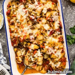 Sausage and Potato Casserole with a spoon in it