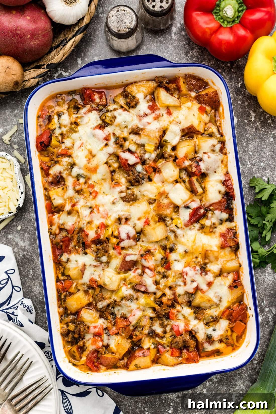Hearty Sausage and Potato Bake 3 A bubbling casserole dish filled with golden-brown Sausage and Potato Casserole, fresh from the oven.