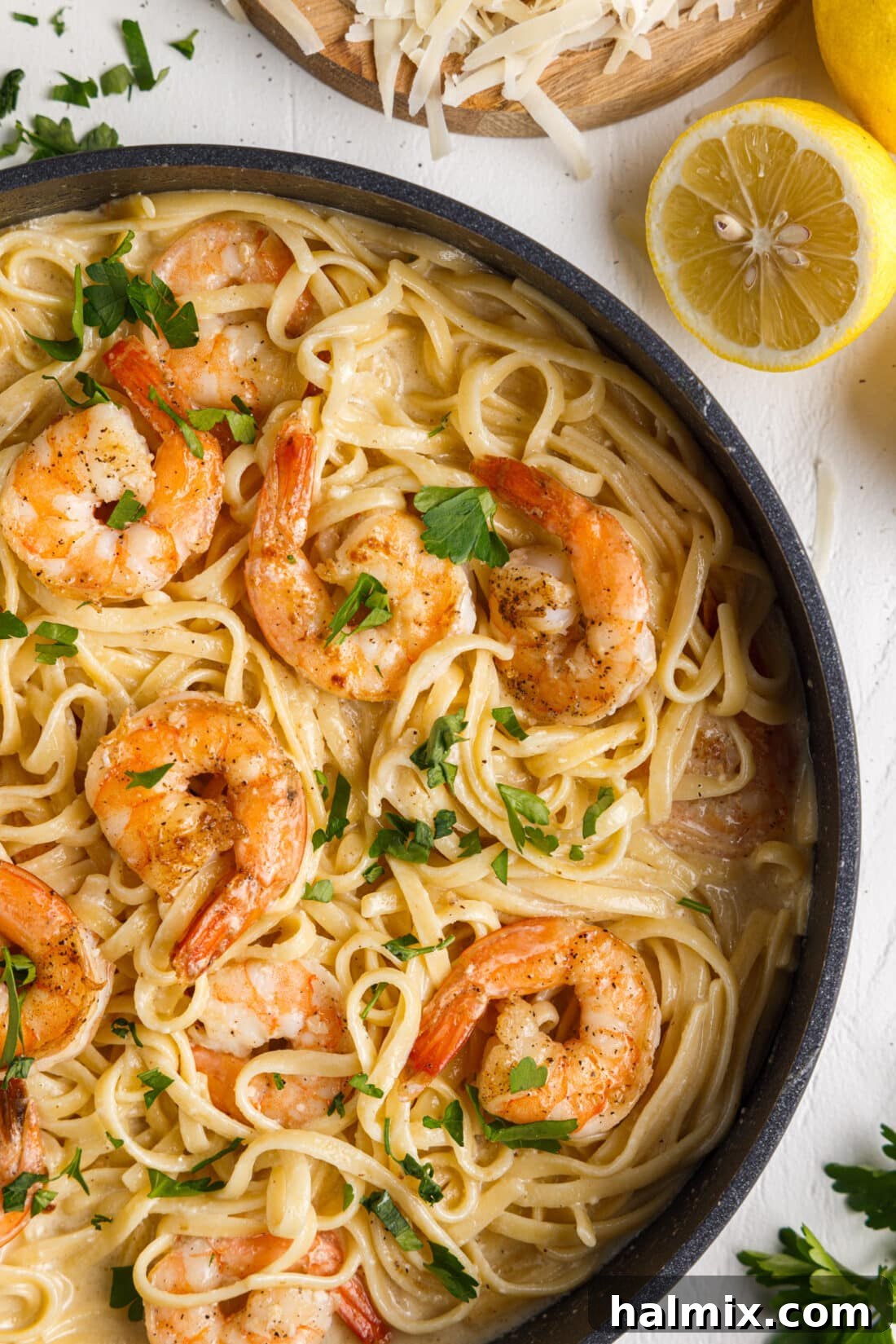 Creamy Garlic Shrimp Pasta 2 Close up photo of Shrimp Pasta in a skillet, showcasing the creamy sauce and plump shrimp