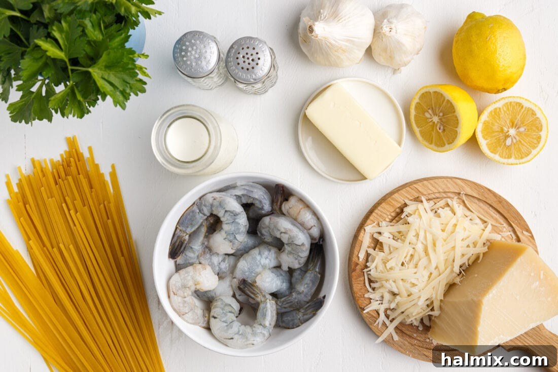 Creamy Garlic Shrimp Pasta 4 Shrimp Pasta ingredients neatly laid out on a cutting board