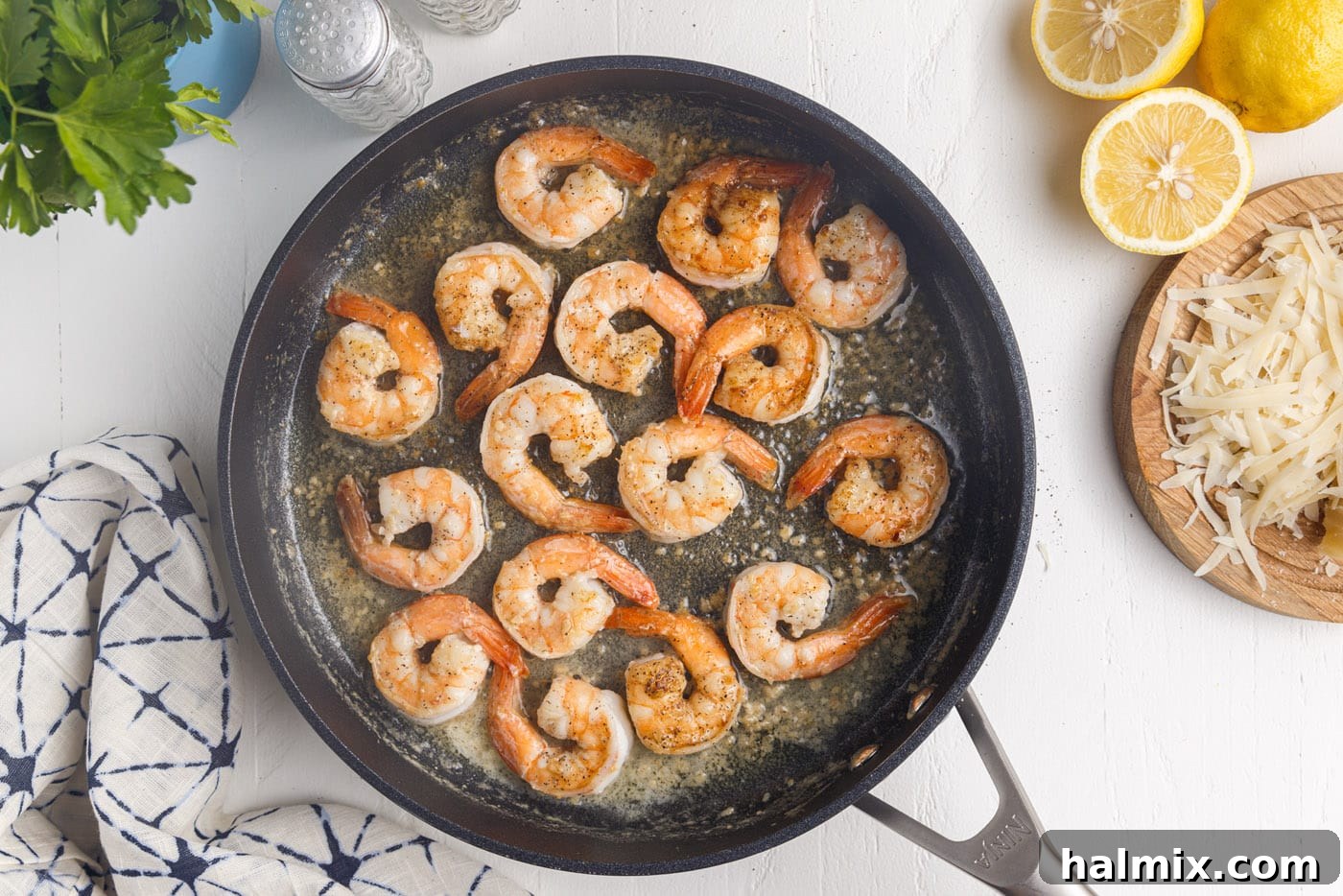 Creamy Garlic Shrimp Pasta 9 cooked jumbo shrimp showing pink and golden hues in a skillet