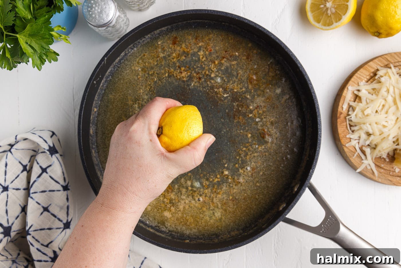 Creamy Garlic Shrimp Pasta 10 pan with melted butter and lemon juice