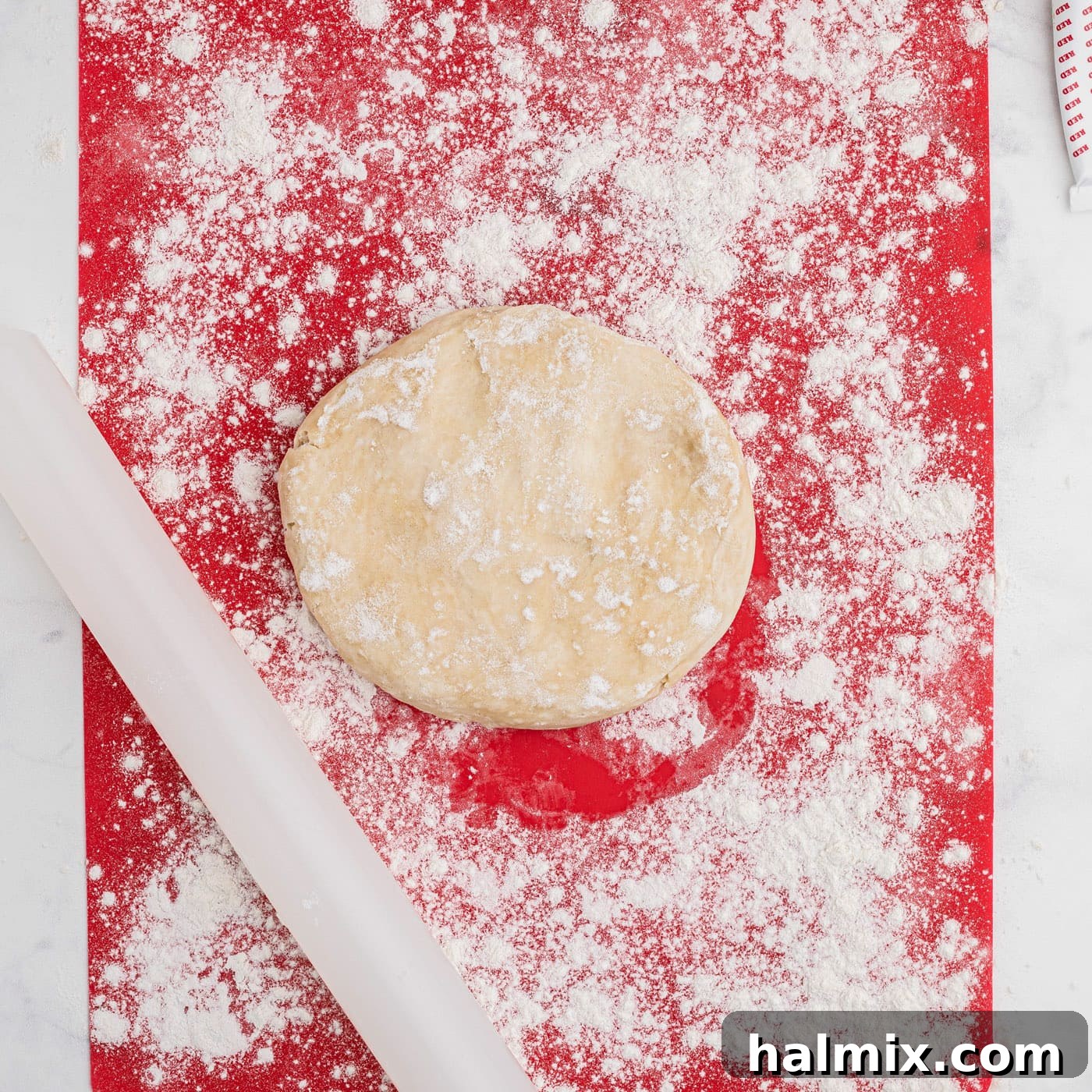 rolling out pie dough with flour