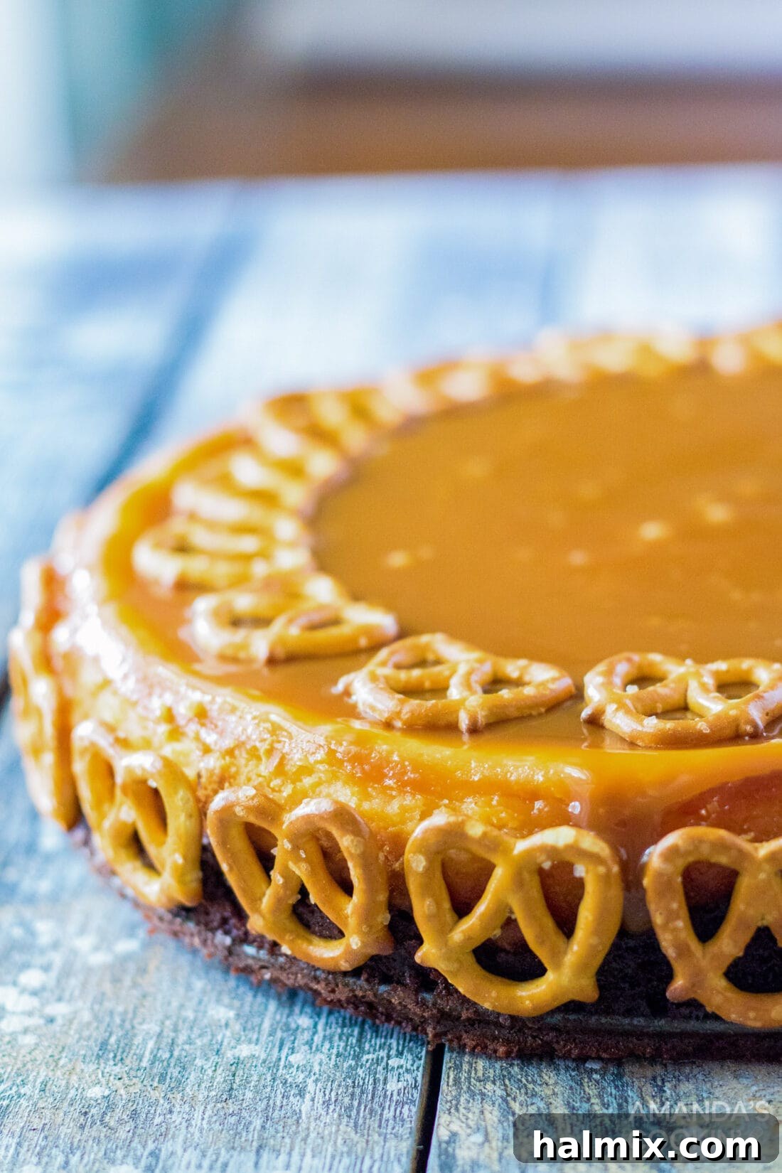 Salted Caramel Cheesecake side view, highlighting the distinct layers
