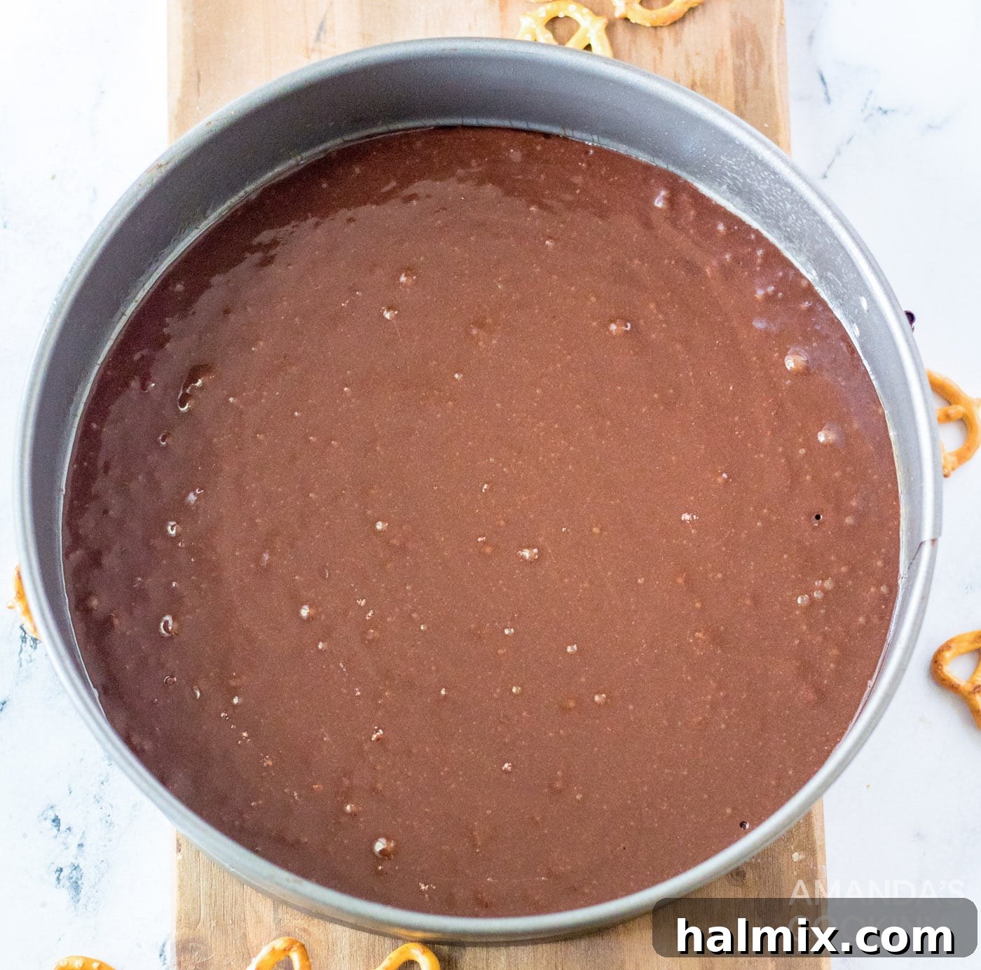 brownie mix in a springform pan ready for baking